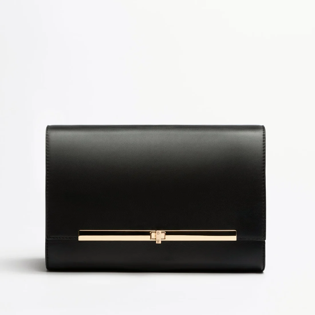Black Alma clutch in smooth leather with a gold bar clasp